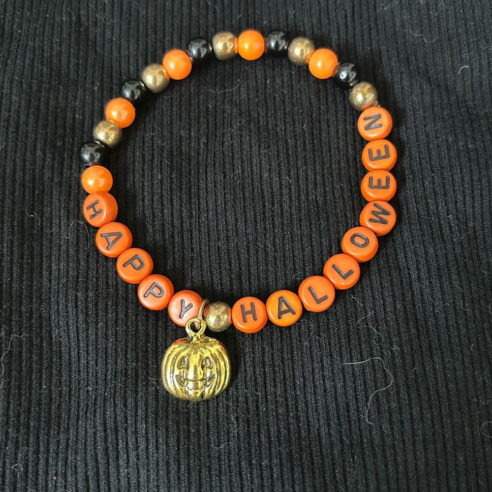 Stretchy Happy Halloween bracelet with pumpkin charm